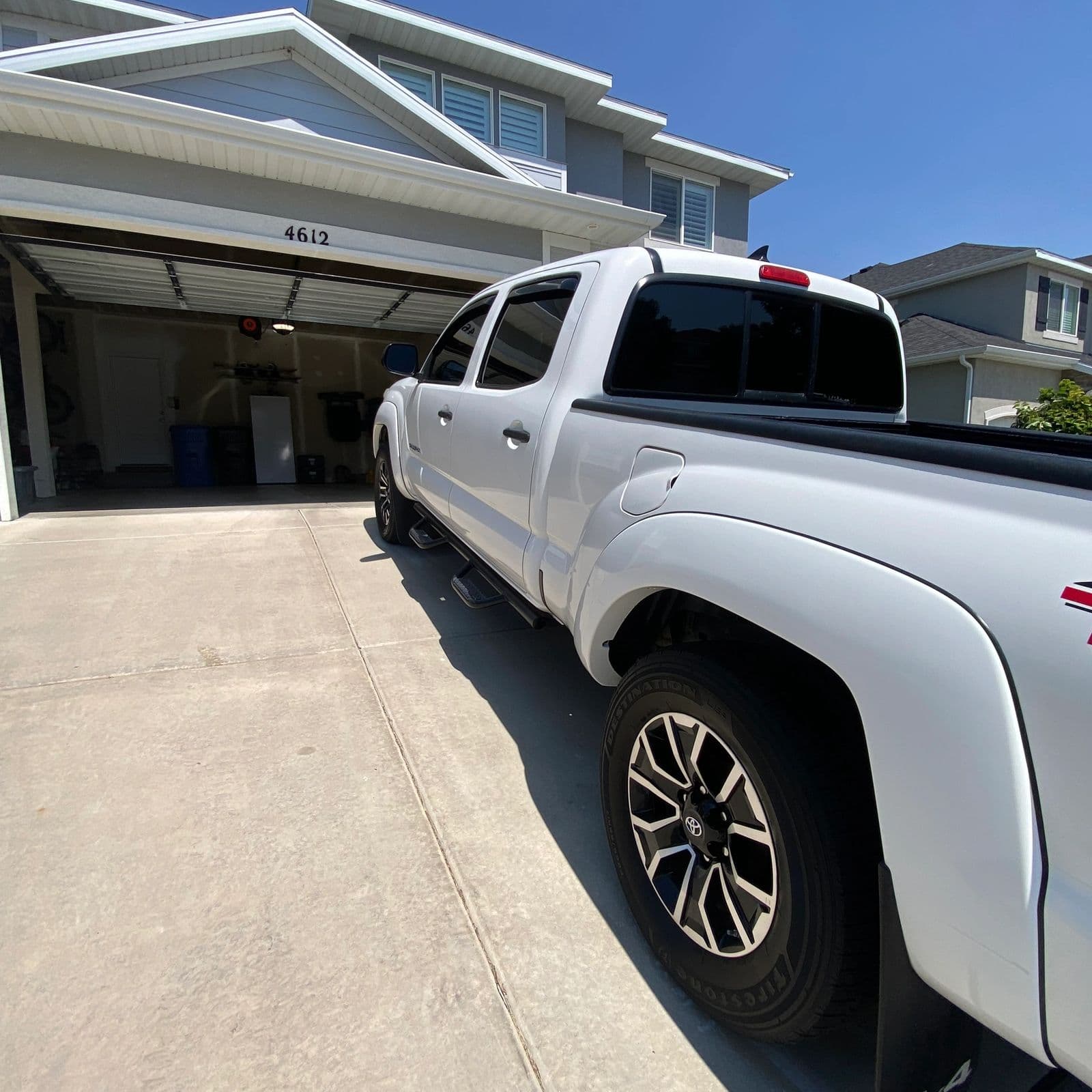 White pickup truck detailed in an open garage, one of Jack's own jobs